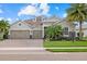 Charming single-story home boasting a three-car garage, well-manicured lawn, and inviting curb appeal at 3808 Eastham Ln, Bradenton, FL 34211