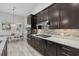 Well-equipped kitchen with dark cabinetry, stainless steel appliances, and a spacious dining area at 3808 Eastham Ln, Bradenton, FL 34211