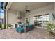 Spacious covered lanai featuring an outdoor kitchen and dining area, perfect for entertaining guests at 3808 Eastham Ln, Bradenton, FL 34211