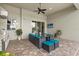 Outdoor lanai with a summer kitchen, a ceiling fan, a television, and comfortable seating at 3808 Eastham Ln, Bradenton, FL 34211