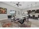 Open-concept living room with stylish decor, blending seamlessly with the kitchen and dining areas at 3808 Eastham Ln, Bradenton, FL 34211