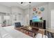 Well-lit living room with decoratively displayed wall art and modern entertainment center at 3808 Eastham Ln, Bradenton, FL 34211