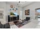 Comfortable living room featuring a mounted TV, modern decor, and neutral color scheme at 3808 Eastham Ln, Bradenton, FL 34211