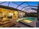 Spacious screened lanai with pool, spa, and lounge seating, seamlessly blending indoor and outdoor living at 3808 Eastham Ln, Bradenton, FL 34211