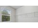 Bright walk-in closet with shelving and a window providing natural light at 3808 Eastham Ln, Bradenton, FL 34211