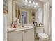 Well-lit bathroom with a spacious vanity, toilet, and shower at 3984 Lyndhurst Ct, Sarasota, FL 34235