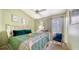 Cozy bedroom with a ceiling fan and a light green color scheme at 3984 Lyndhurst Ct, Sarasota, FL 34235