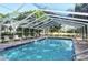 Relaxing community pool with an enclosure offers a refreshing oasis for residents to enjoy at 3984 Lyndhurst Ct, Sarasota, FL 34235