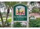 A Lyndhurst Court neighborhood sign surrounded by lush landscaping creates an inviting atmosphere for residents at 3984 Lyndhurst Ct, Sarasota, FL 34235