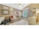 Comfortable home office features a large window and built-in shelves at 3984 Lyndhurst Ct, Sarasota, FL 34235