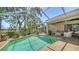 Private pool area with a screened-in lanai and scenic backyard views at 3984 Lyndhurst Ct, Sarasota, FL 34235