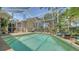 Screened-in pool area features lush landscaping and a tranquil setting at 3984 Lyndhurst Ct, Sarasota, FL 34235