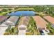 An aerial view of single-story homes with a lake in the background at 4016 Azurite Way, Bradenton, FL 34211