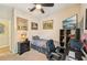 Bedroom with neutral decor, desk, and simple furnishings, ideal for a guest room or home office at 4016 Azurite Way, Bradenton, FL 34211