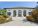 Clubhouse exterior with an elegant architectural design and vibrant landscaping at 4016 Azurite Way, Bradenton, FL 34211