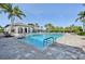 Beautiful community pool with palm trees and many chairs for residents at 4016 Azurite Way, Bradenton, FL 34211