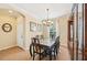 Bright dining room with a glass-top table, elegant chairs, and stylish decor at 4016 Azurite Way, Bradenton, FL 34211