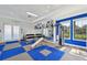 Bright fitness center with weights, machines and floor-to-ceiling mirrors at 4016 Azurite Way, Bradenton, FL 34211