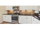 Well-equipped kitchen with stainless steel appliances, ample cabinet space, and sleek granite countertops at 4016 Azurite Way, Bradenton, FL 34211