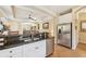 Spacious kitchen area with stainless steel appliances, granite countertops, and easy access to the dining area at 4016 Azurite Way, Bradenton, FL 34211