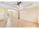 Bright, spacious living room featuring tile floors, ceiling fan, and elegant architectural details at 4016 Azurite Way, Bradenton, FL 34211