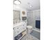 Bathroom featuring modern vanity, mirrored wall decor, and sliding glass shower doors at 4111 E 13Th E St, Ellenton, FL 34222