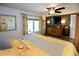 Main bedroom with bright window views, dresser, and decorative wallpaper accent wall at 4111 E 13Th E St, Ellenton, FL 34222