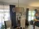 Dining room features a modern light fixture and views of the outdoors at 4111 E 13Th E St, Ellenton, FL 34222