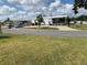 Charming single-story home features a covered porch, manicured landscaping, and a well-maintained lawn at 4111 E 13Th E St, Ellenton, FL 34222