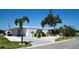 Charming single-story home with a well-maintained yard, palm trees, and covered parking at 4111 E 13Th E St, Ellenton, FL 34222