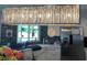 Modern kitchen boasts a stunning light fixture, stainless steel appliances, and blue subway tile backsplash at 4111 E 13Th E St, Ellenton, FL 34222
