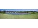 Scenic view of the lake, surrounded by lush greenery and neighborhood homes at 4111 E 13Th E St, Ellenton, FL 34222