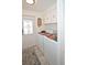 Laundry room with washer, dryer, cabinets, and exterior door at 4111 E 13Th E St, Ellenton, FL 34222