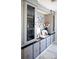 Built-in cabinetry with glass doors, drawers, and lighting at 4111 E 13Th E St, Ellenton, FL 34222