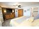 Stylish main bedroom features wood-look flooring, an accent wall, and a ceiling fan with lighting at 4111 E 13Th E St, Ellenton, FL 34222