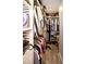 Organized walk-in closet with built-in shelving and hanging rods provides ample storage space at 4111 E 13Th E St, Ellenton, FL 34222