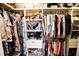 This walk-in closet has customized shelving and hanging space that maximizes clothing storage at 4111 E 13Th E St, Ellenton, FL 34222