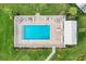 Aerial view of sparkling pool surrounded by mature landscaping and lounge furniture at 4313 Carol Ann Rd # 20, Sarasota, FL 34233