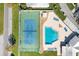 Aerial view of community pool and tennis court, offering recreational amenities at 4313 Carol Ann Rd # 20, Sarasota, FL 34233
