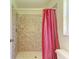 Bathroom features a tiled shower with adjustable shower head and a red curtain at 4313 Carol Ann Rd # 20, Sarasota, FL 34233