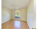 Spacious bedroom featuring a window and laminate wood flooring at 4313 Carol Ann Rd # 20, Sarasota, FL 34233