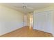 Cozy bedroom with wood floors, closet, ceiling fan, and plenty of natural light at 4313 Carol Ann Rd # 20, Sarasota, FL 34233