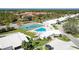 Aerial view of the community featuring a pool, tennis court, and beautiful landscaping at 4313 Carol Ann Rd # 20, Sarasota, FL 34233