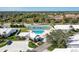 Aerial view of the community pool and tennis court, surrounded by well-maintained landscaping at 4313 Carol Ann Rd # 20, Sarasota, FL 34233