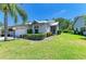 Charming home with manicured lawn, lush landscaping and a cozy, inviting entrance at 4313 Carol Ann Rd # 20, Sarasota, FL 34233