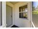 Inviting front entrance featuring a window and storm door, creating a welcoming atmosphere at 4313 Carol Ann Rd # 20, Sarasota, FL 34233