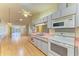 Bright kitchen featuring a double sink and view into a large living room at 4313 Carol Ann Rd # 20, Sarasota, FL 34233