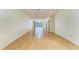 Bright living room with wood floors and sliding glass doors to a screened porch at 4313 Carol Ann Rd # 20, Sarasota, FL 34233