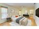 Relaxing main bedroom retreat featuring a king bed, a ceiling fan, and ensuite bathroom at 4313 Carol Ann Rd # 20, Sarasota, FL 34233