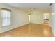 Bedroom featuring wood floors, ceiling fan, and ensuite bathroom at 4313 Carol Ann Rd # 20, Sarasota, FL 34233